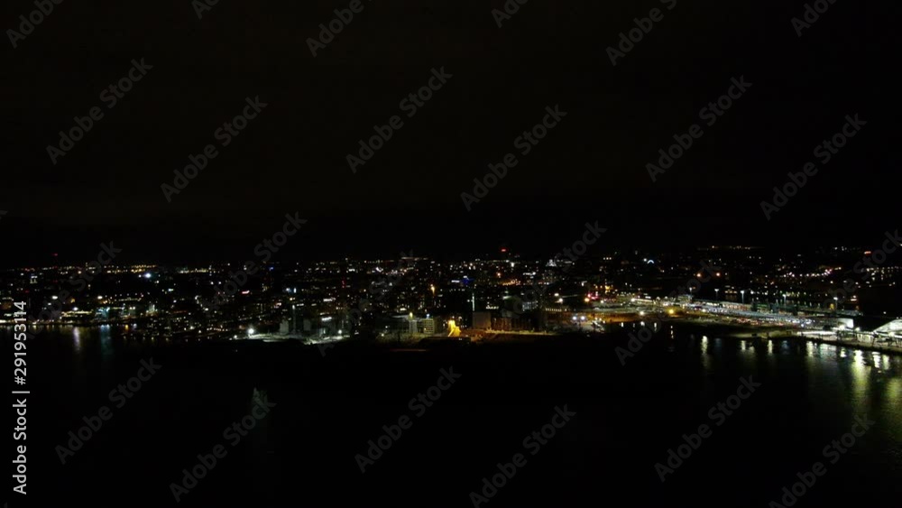 Flying over city lights in dark night. Aerial drone shot. Flying over city lights in dark night. Aerial drone shot.