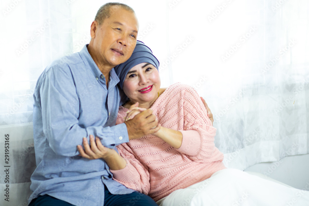 Elderly Husband encouraging his wife during chemotherapy to cure cancer