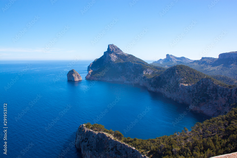 Mallorca panorama view with Mountains and green forest and blue sky and people on the viewpoint 