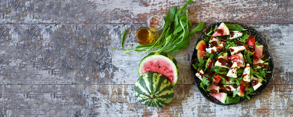 Healthy salad with arugula, blue cheese and mini watermelon. Autumn watermelon salad. Keto friendly. Vegetarian food. Fitness salad. Keto diet. Selective focus. Macro. Healthy salad with arugula, blue cheese and mini watermelon. Autumn watermelon salad. Keto friendly. Vegetarian food. Fitness salad. Keto diet. Selective focus. Macro.
