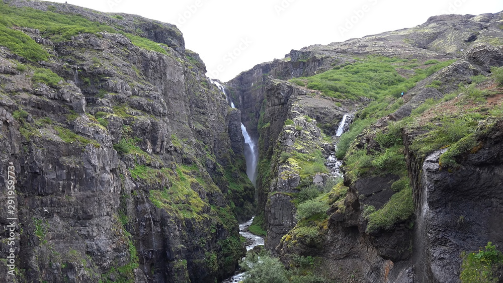 waterfall in the mountains in Iceland