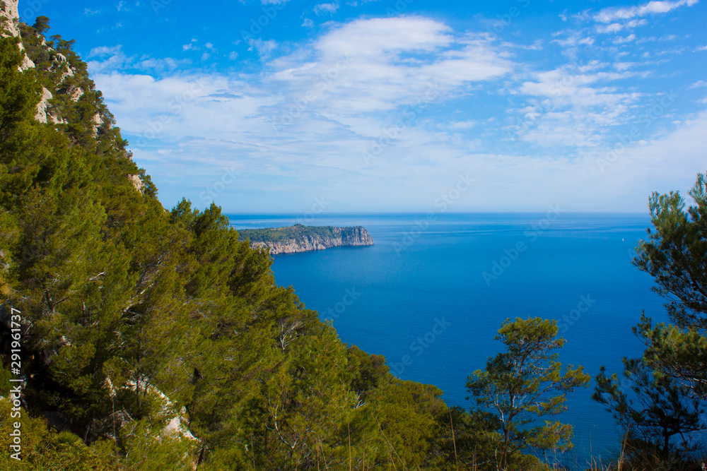 Mallorca panorama view with Mountains and green forest and blue sky and Mediterranen sea 