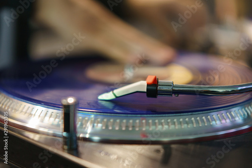 Photography of modern vinyl turntable with vinyl plate. Listen to music. Close view from above.
