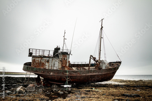 Abandoned ship on the coast of the Arctic Ocean.