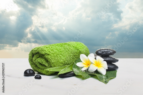 Spa objects (towel, flowers. stones, leaves) for healthy therapy photo