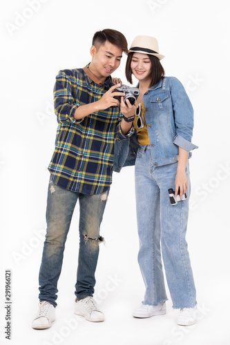 Traveler asian couple with backpack and suitcase standing isolated over white background.Couple Asian  going to summer vacation.People, active lifestyle, relaxation and joy concept.