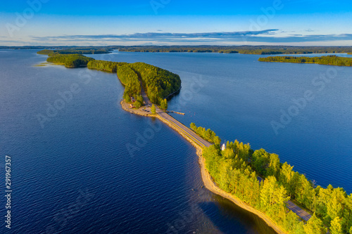 Aerial view of Pulkkilanharju Ridge, Paijanne National Park, southern part of Lake Paijanne. Landscape with drone. Blue lakes, road and green forests from above on a sunny summer day in Finland. photo