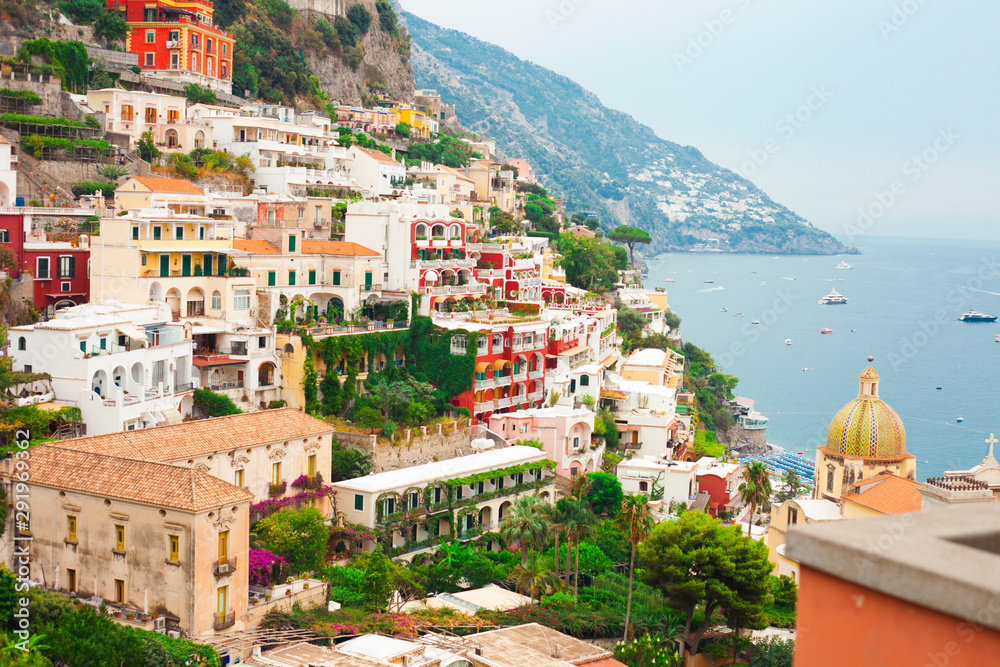 View of beautiful town Positano. Amazing buildings, nature and sea. Tourism, vacation, nature concept.