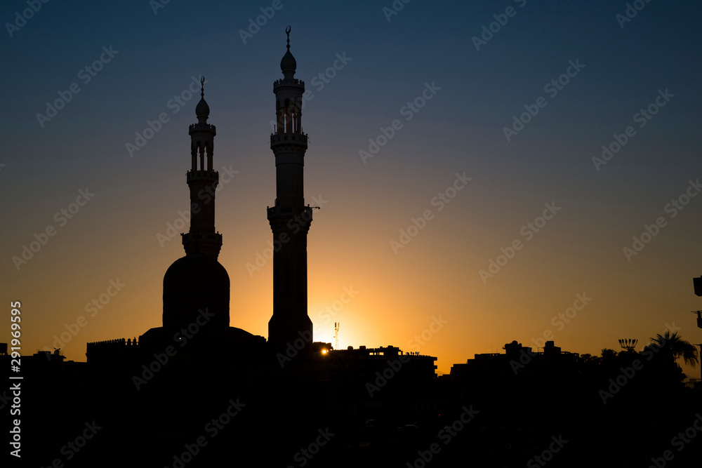 Silhouettes of mosque minarets at sunset, Hurghada, east Egypt