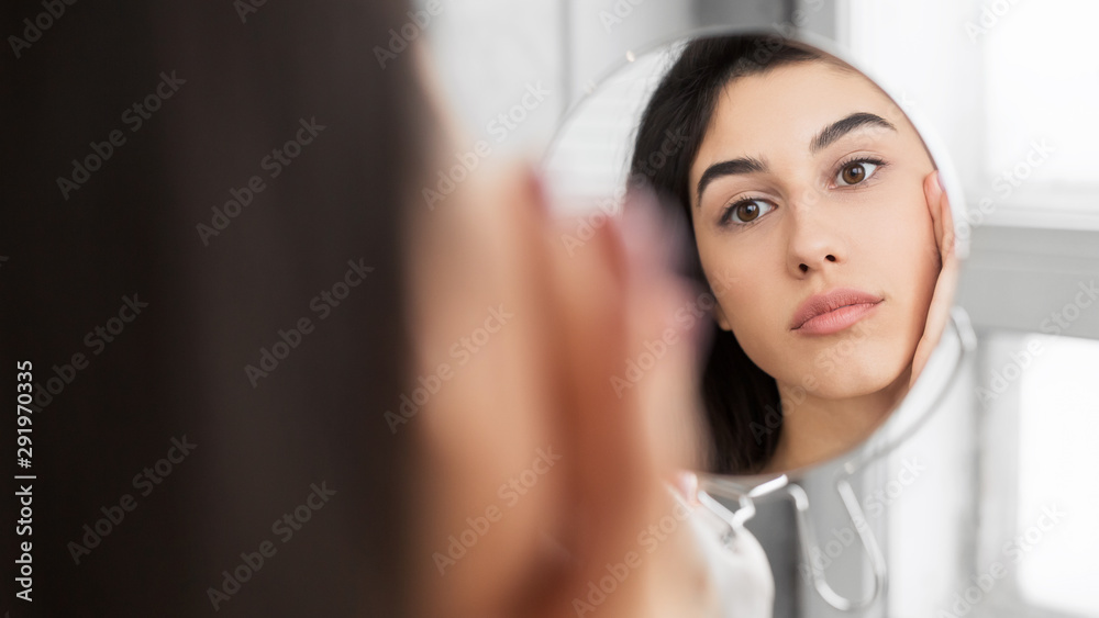 Girl Touching Face Looking At Perfect Skin In Mirror, Panorama Girl Touching Face Looking At Perfect Skin In Mirror, Panorama