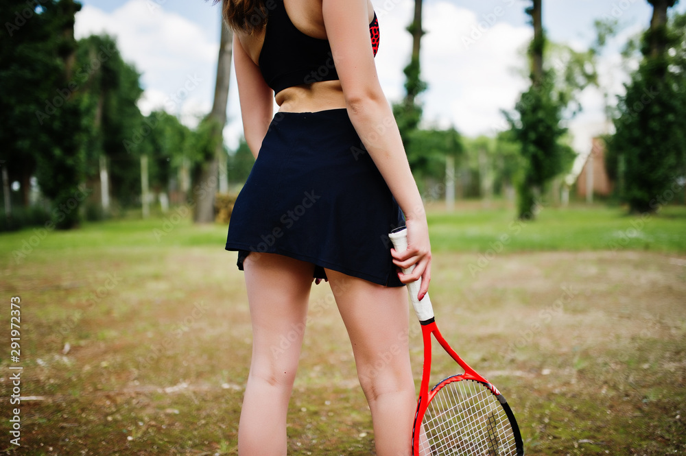 Beautiful sport woman tennis player with racket in sportswear costume.