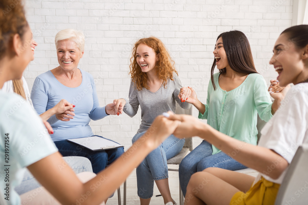Smiling Diverse Women Sitting In Circle During Group Therapy Indoor - obrazy, fototapety, plakaty 