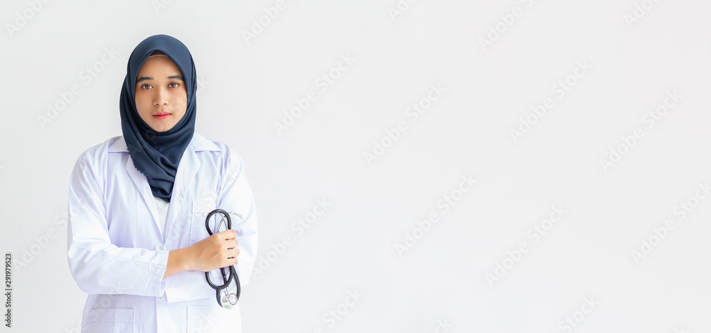 Young Arab Muslim intern doctor women smile on isolate white background concept for Islam people working in medical hospital health care, Modern Nurse wearing hijab in medico clinic business service. Young Arab Muslim intern doctor women smile on isolate white background concept for Islam people working in medical hospital health care, Modern Nurse wearing hijab in medico clinic business service.