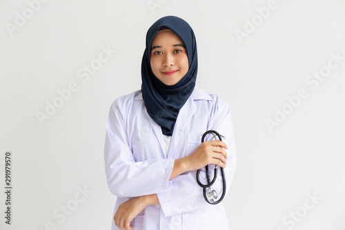 Bild auf Leinwand Young Arab Muslim intern doctor women smile on isolate white background concept for Islam people working in medical hospital health care, Modern Nurse wearing hijab in medico clinic business service