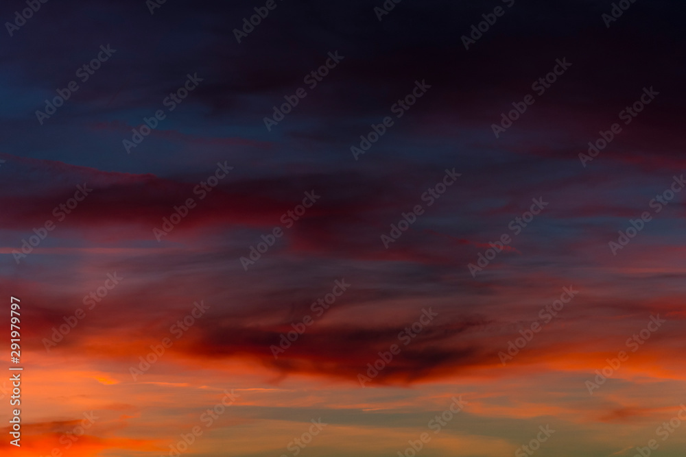 Beautiful sky during sunset. Colorful alpenglow. Orange violet yellow color on the sky.