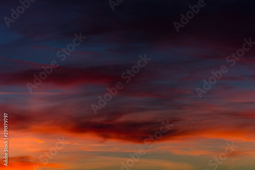 Beautiful sky during sunset. Colorful alpenglow. Orange violet yellow color on the sky.