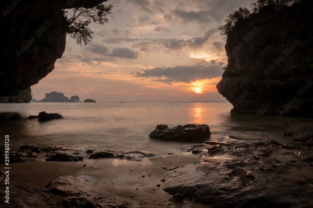 Sunset in Thailand. Small private beach. Very calm water. Long exposure