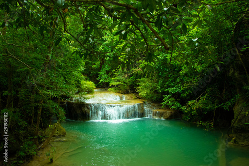 Waterfalls and lush vegetation during the rainy season. © Napatsorn