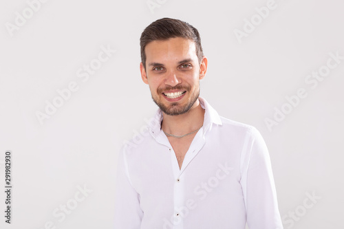 Happy young casual man portrait isolated on white background © satura_