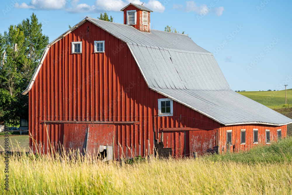 Old red barn in a field in the Palouse region of Washington State