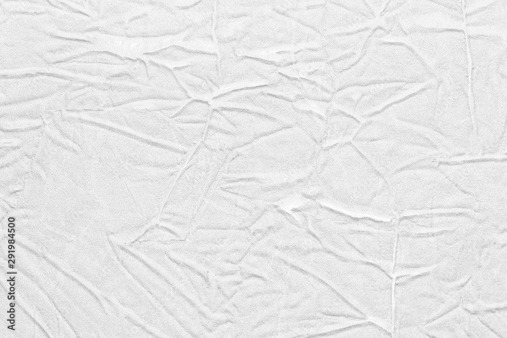 Obraz premium White crumpled leather texture. fabric with folds imitation under genuine leather. background. wallpaper