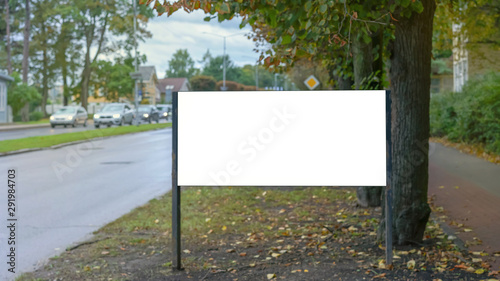 billboard with empty white space for advertising hotel or restaurant near road with cars, mock-up