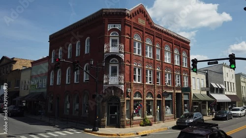 Historical building dominates the corner in this low aerial view of the streets of Lewisburg West Virginia. photo