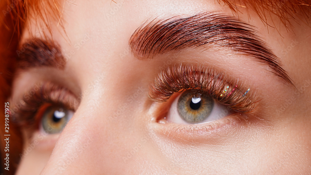 Beautiful macro photography of a woman's eye with extreme make-up of long eyelashes. Beautiful macro photography of a woman's eye with extreme make-up of long eyelashes.