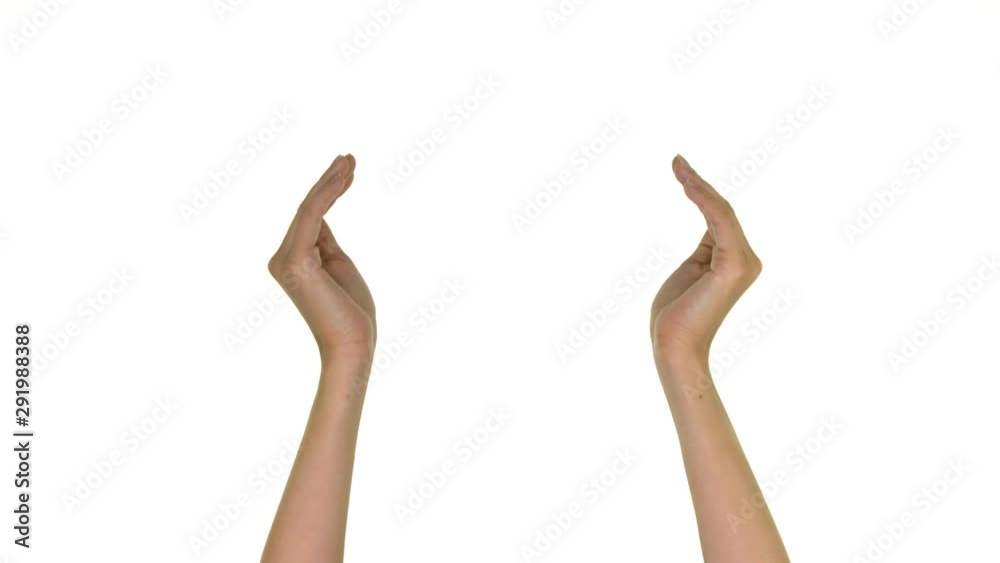 Close-up of two hands coming in screen on a white background. Close-up of two hands coming in screen on a white background.