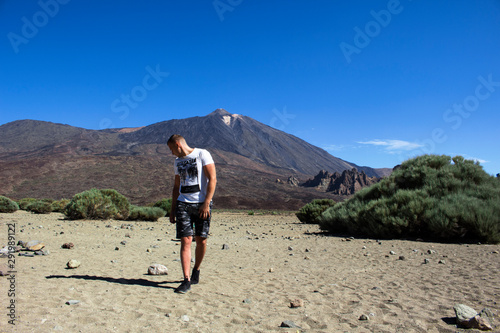 young man by the peak of volcano Teide
