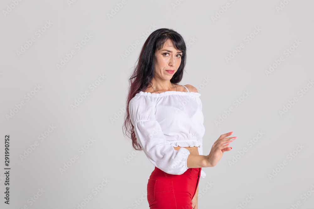 Latino dance, Improvisation, contemporary and vogue dance concept - young beautiful woman dancing on studio background Latino dance, Improvisation, contemporary and vogue dance concept - young beautiful woman dancing on studio background
