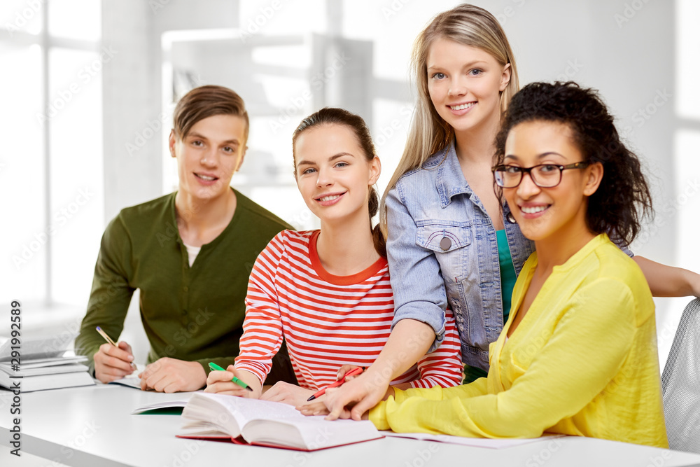 education, learning and people concept - happy high school students or classmates with books and notebooks education, learning and people concept - happy high school students or classmates with books and notebooks