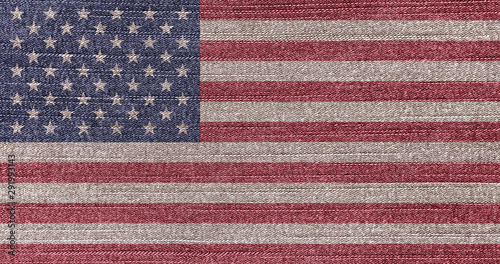 Grunge faded flag of USA. Isolated American banner on denim fabric. Rustic vintage style. U.S. independence, Memorial day.