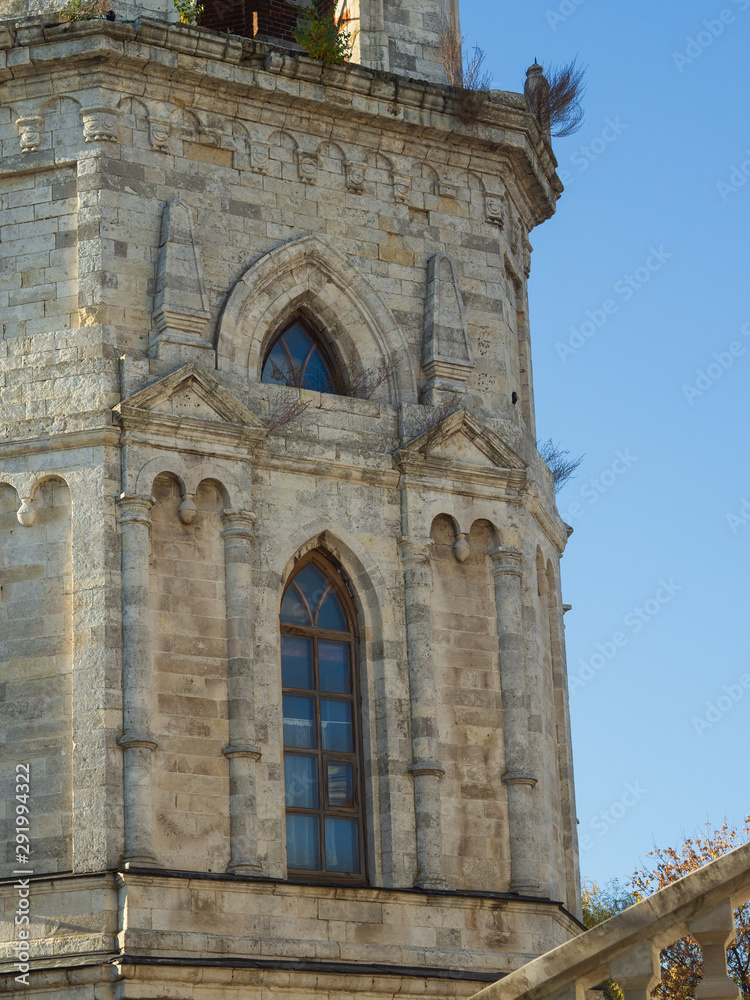 Facade with window of Orthodox church of the 18th century. Pseudo-Gothic style of architecture.