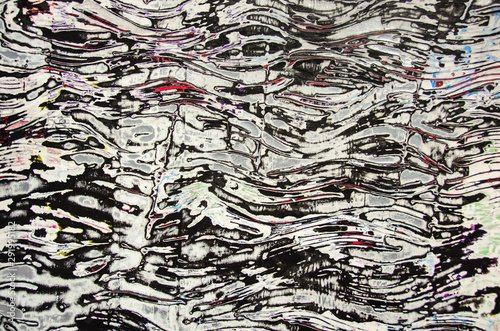 Layers of paint and paper in cross section