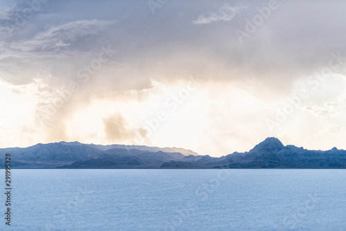 Bonneville Salt Flats and storm clouds near Salt Lake City, Utah and mountain view during sunset with nobody
