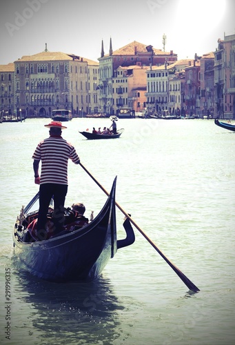 Gondolier in Grand Canal in Venice with old toned effect © ChiccoDodiFC