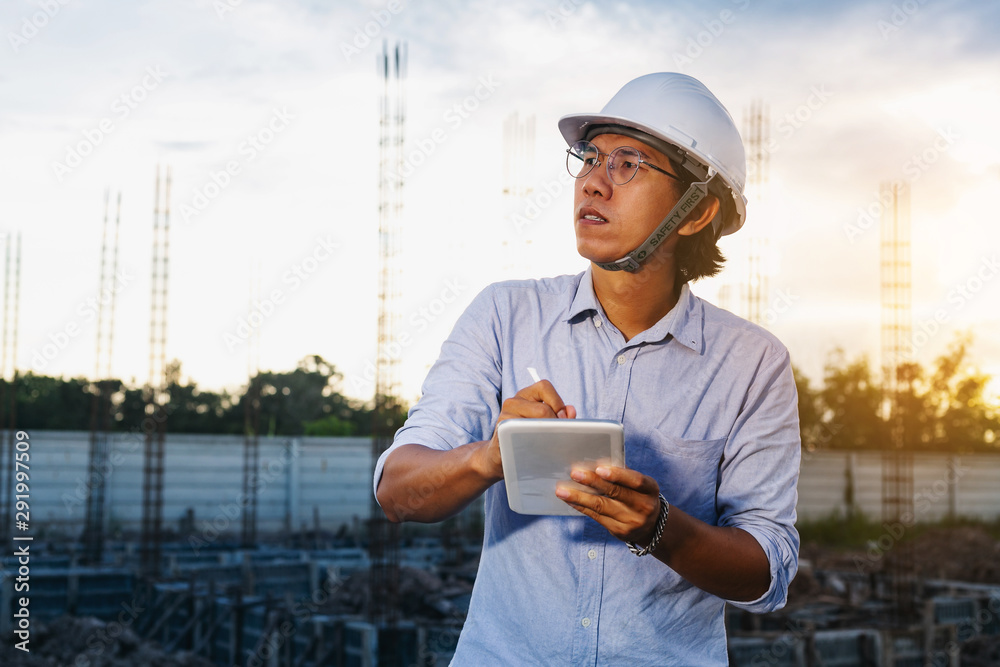 Fototapeta premium Male architect, inspecting house construction