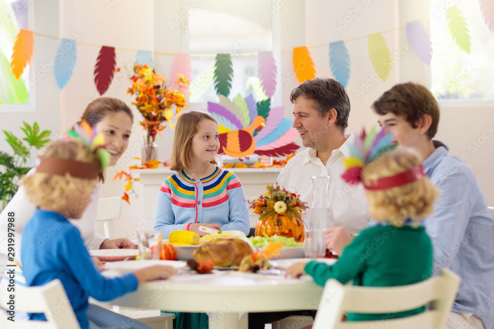 Family with kids at Thanksgiving dinner. Turkey. Family with kids at Thanksgiving dinner. Turkey.