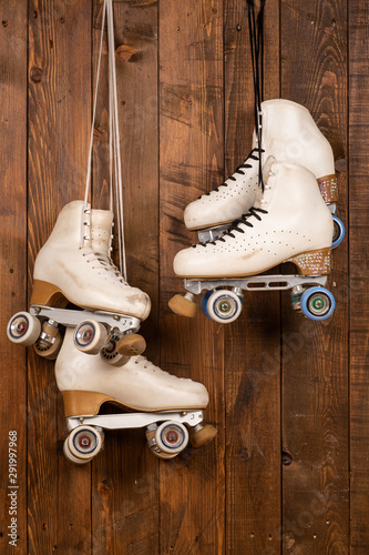 artistic roller skates on a wood background