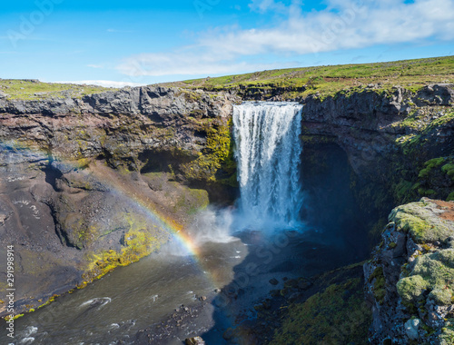 Beautifull waterfall on the Skoga River with rainbow and no people on famous Fimmvorduhals trail second part of Laugavegur trek. Summer landscape on a sunny day. Amazing in nature. August 2019  South