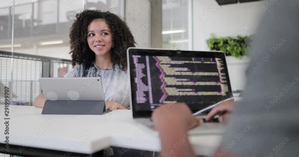 African American female student coding in class