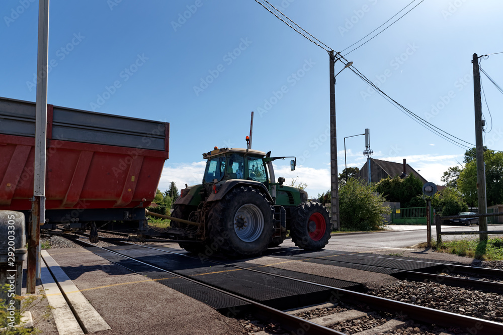 Fototapeta premium tractor at level crossing in Seine et Marne country