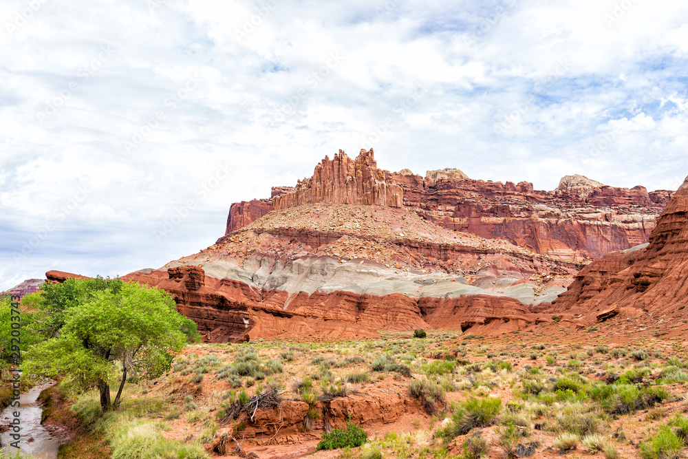 Red rock sandstone formations landscape view with green river in summer in Capitol Reef National Monument in Utah