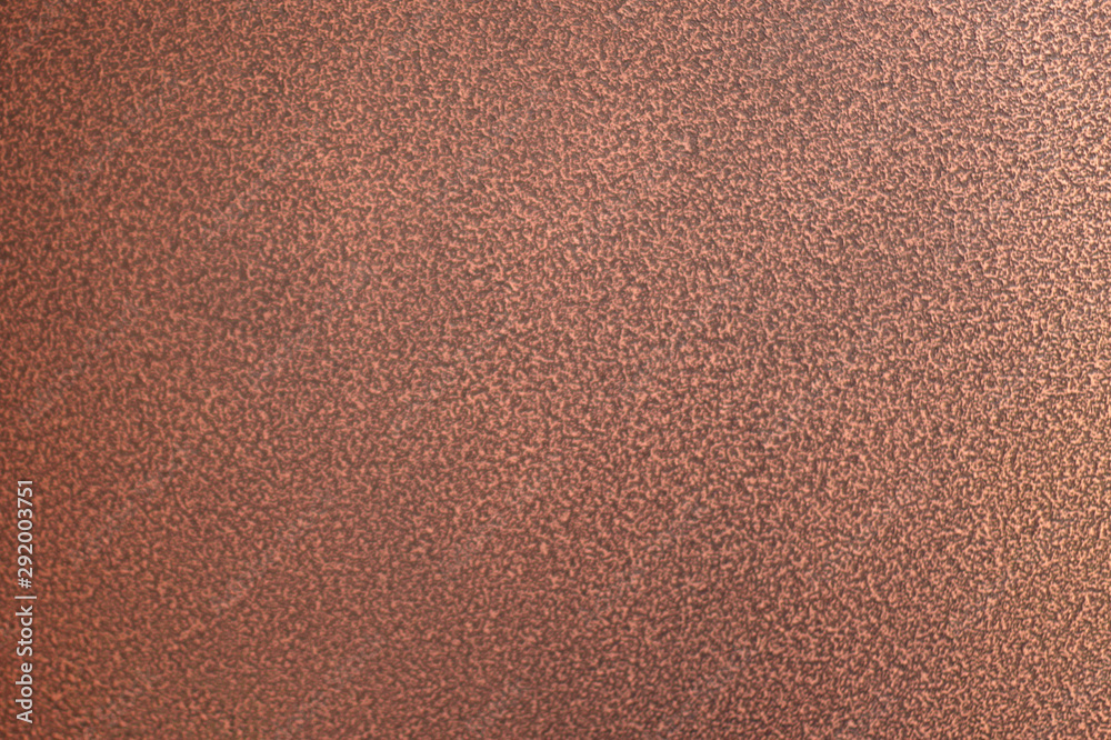 The texture of the smooth brown surface of the metal door to the apartment The texture of the smooth brown surface of the metal door to the apartment