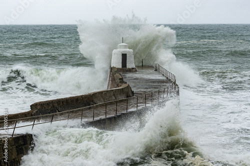  Sea crashing over the pier at Portreath