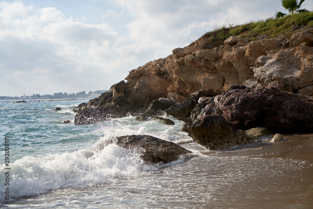 Fantastic blue water sea coastline view with rocky hills and reefs Fantastic blue water sea coastline view with rocky hills and reefs