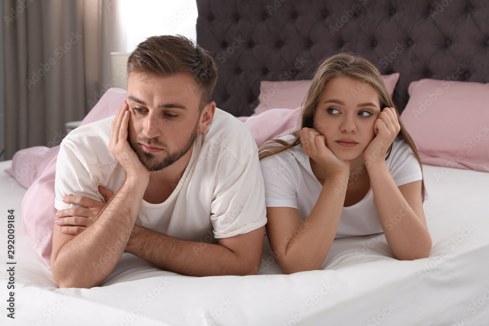Young couple with relationship problems in bed at home Young couple with relationship problems in bed at home