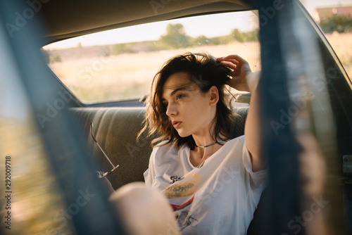 Young woman sitting in car photo