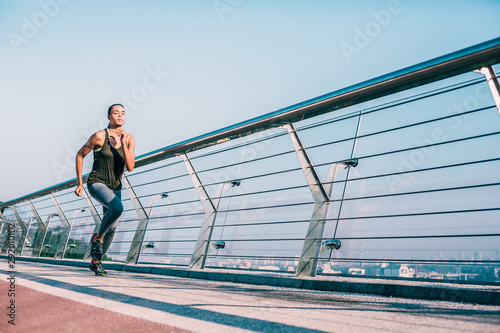 Determination of young professional runner stock photo
